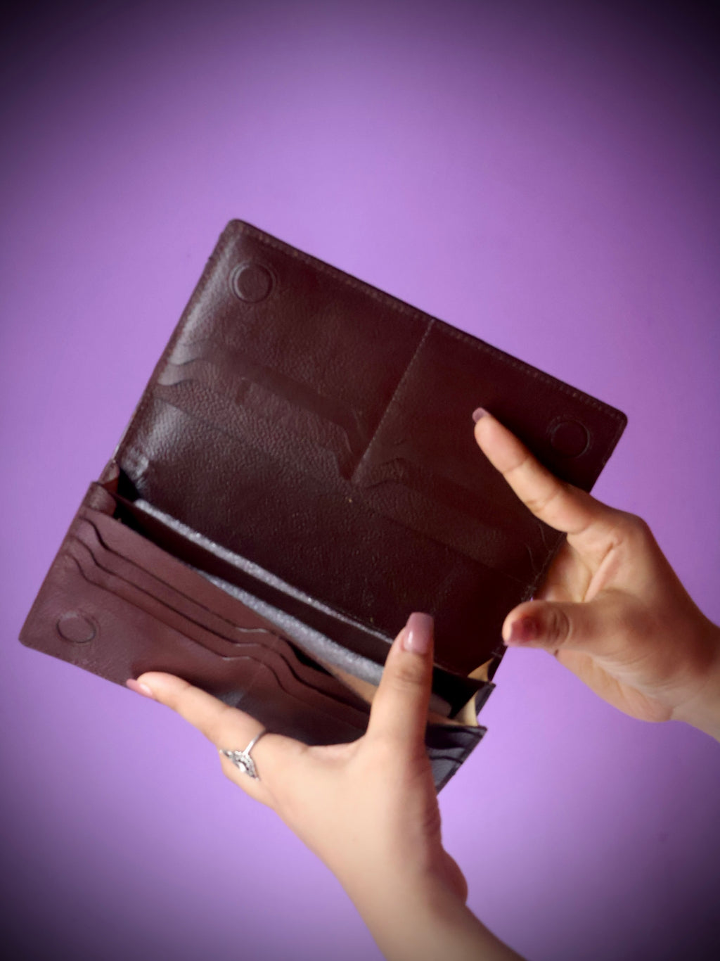 Premium cow leather long wallet dark brown - front view with embossed logo clasp