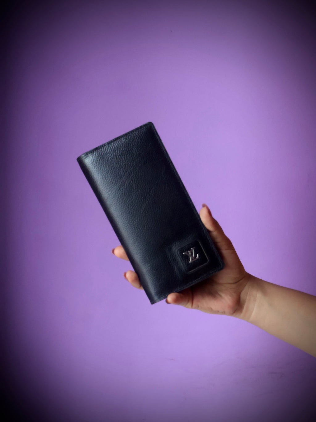 Premium cow leather long wallet black - front view with embossed logo clasp