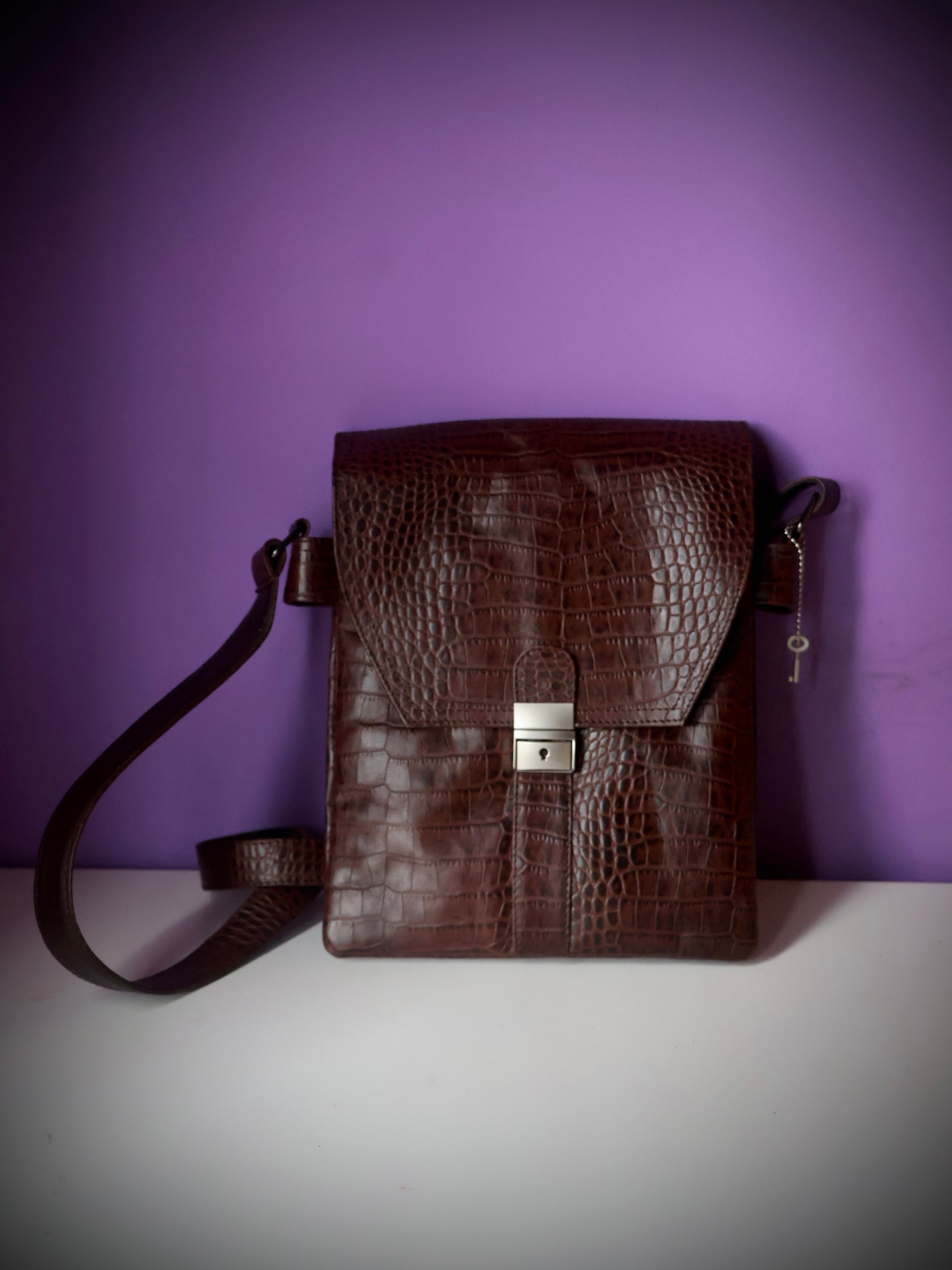 Croco embossed leather messenger satchel bag dark brown - front view showing silver lock clasp and key charm