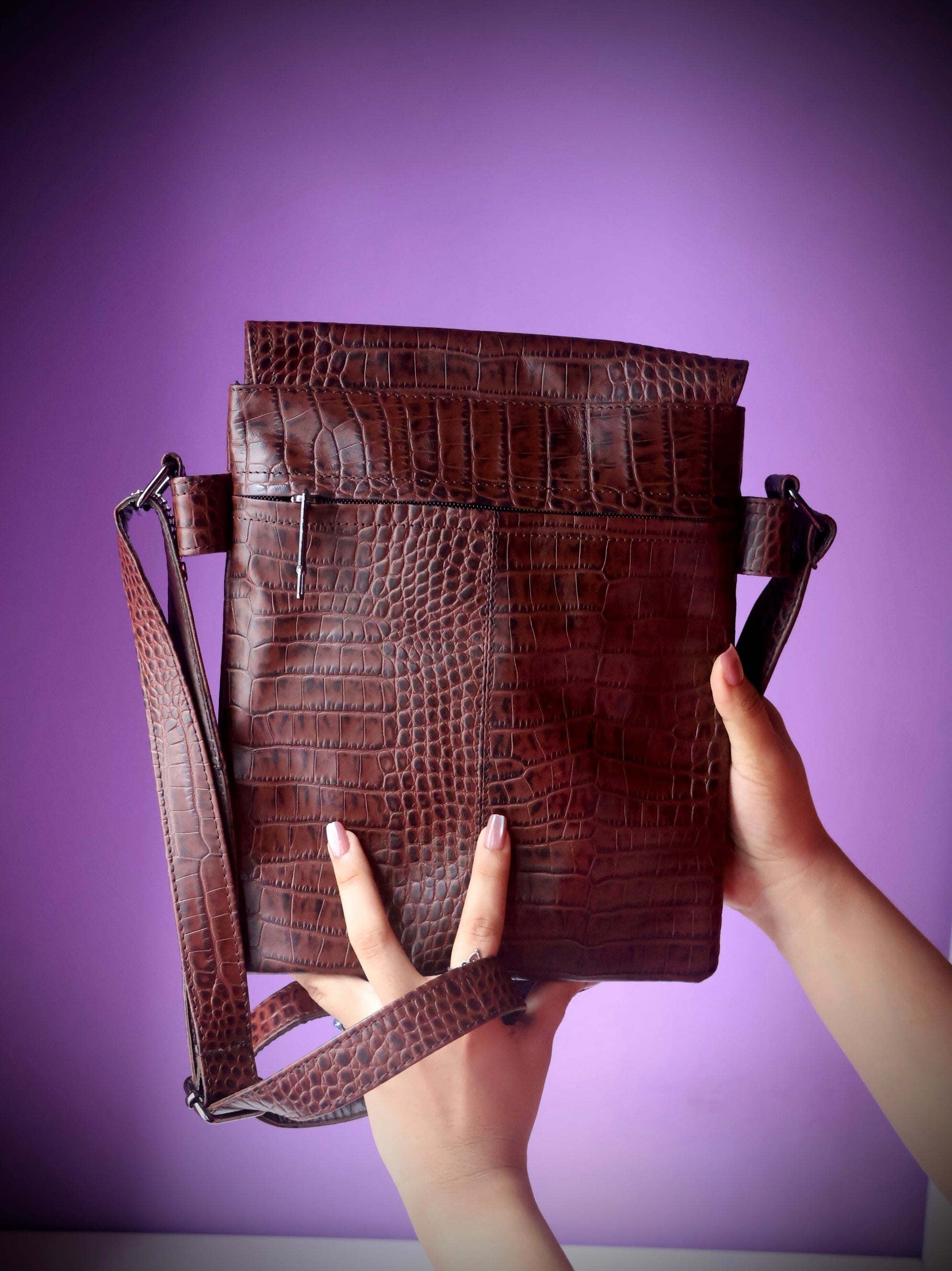 Croco embossed leather messenger satchel bag dark brown - held view showing size and adjustable croco strap