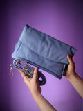 Original leather crossbody clutch bag sky blue - front view with silver zipper pocket and detachable strap