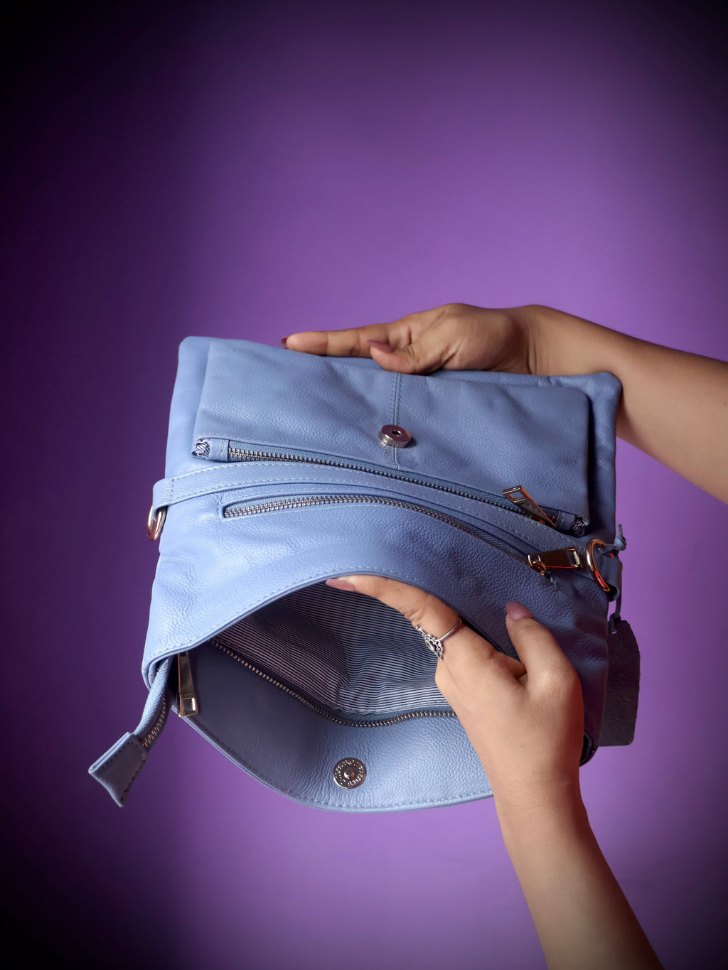 Original leather crossbody clutch bag sky blue - open interior showing inner zipper pocket and compartments