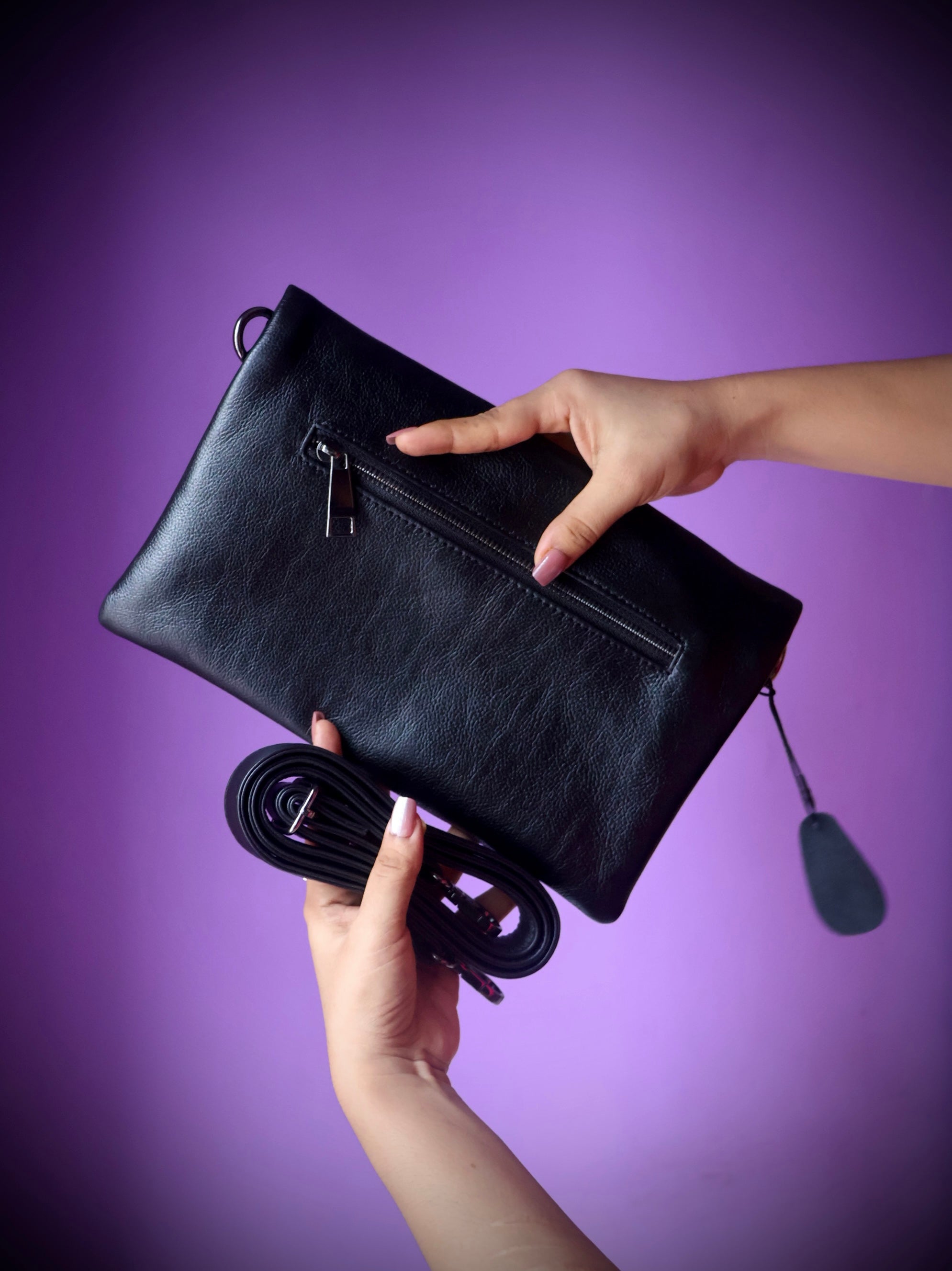 Original leather crossbody clutch bag black - side view with detachable crossbody strap
