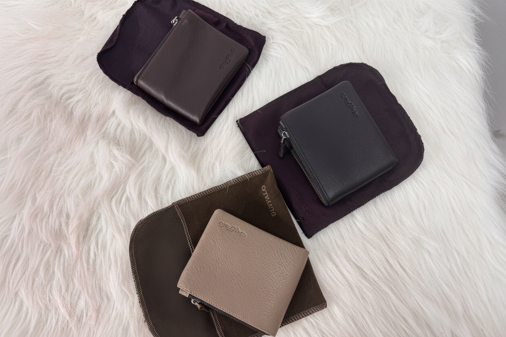 Buffalo wallets with dust bags flat lay